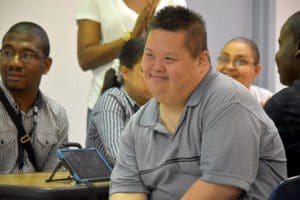 Danny Wong smiles as his peers celebrate his birthday