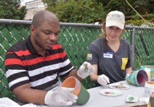 Christian Cameau with Rachel, a KIND employee who volunteered at the event