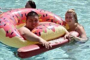 William Zhang and Megan Bradfoot enjoying the summer weather in the Camp Anne pool.