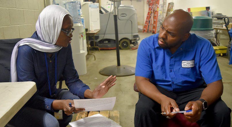 Hindou Kane and David Jackson discuss the day's work schedule