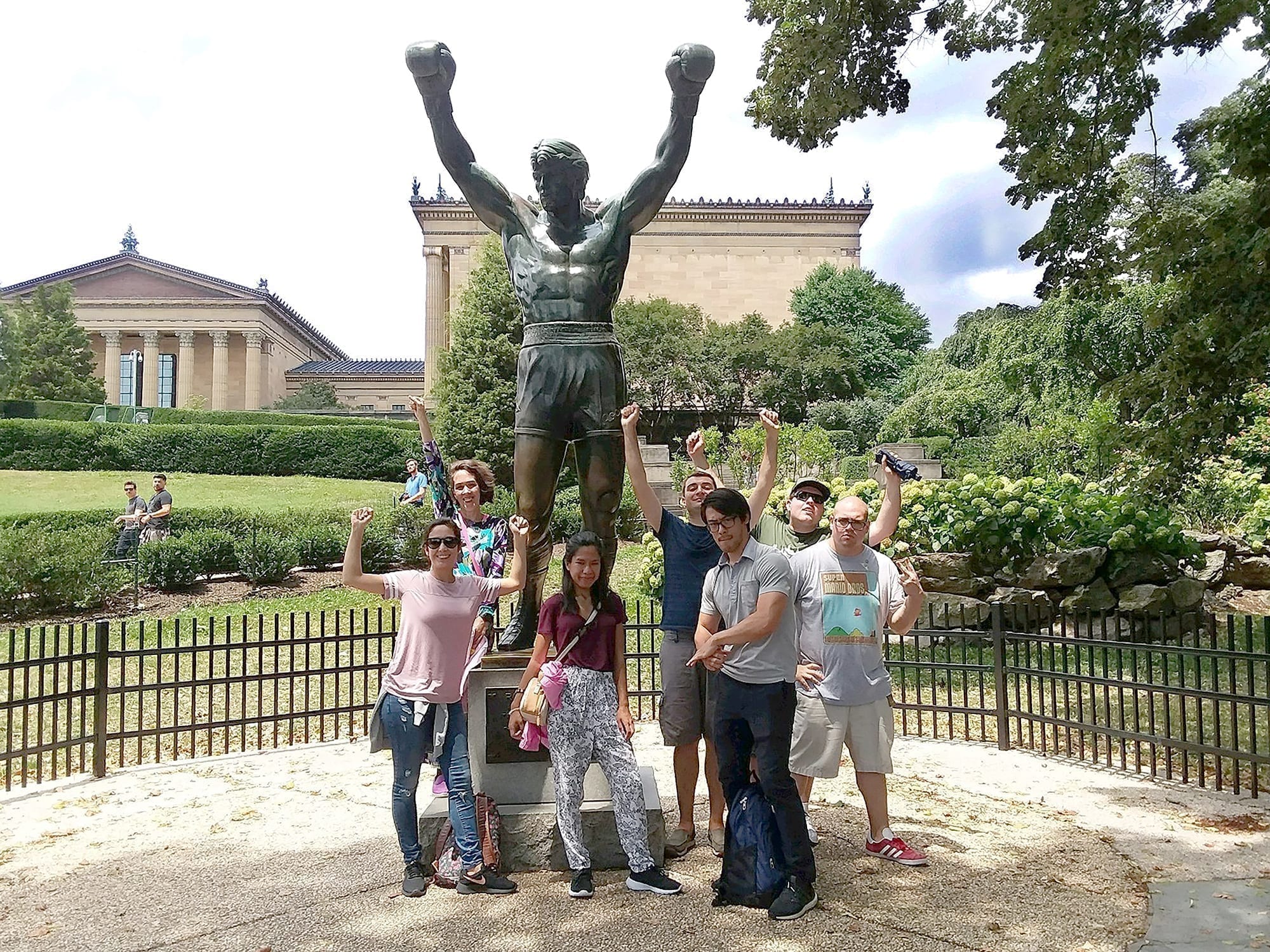 Grads and staff members posed with the Rocky statue outside the Philadelphia Museum of Art