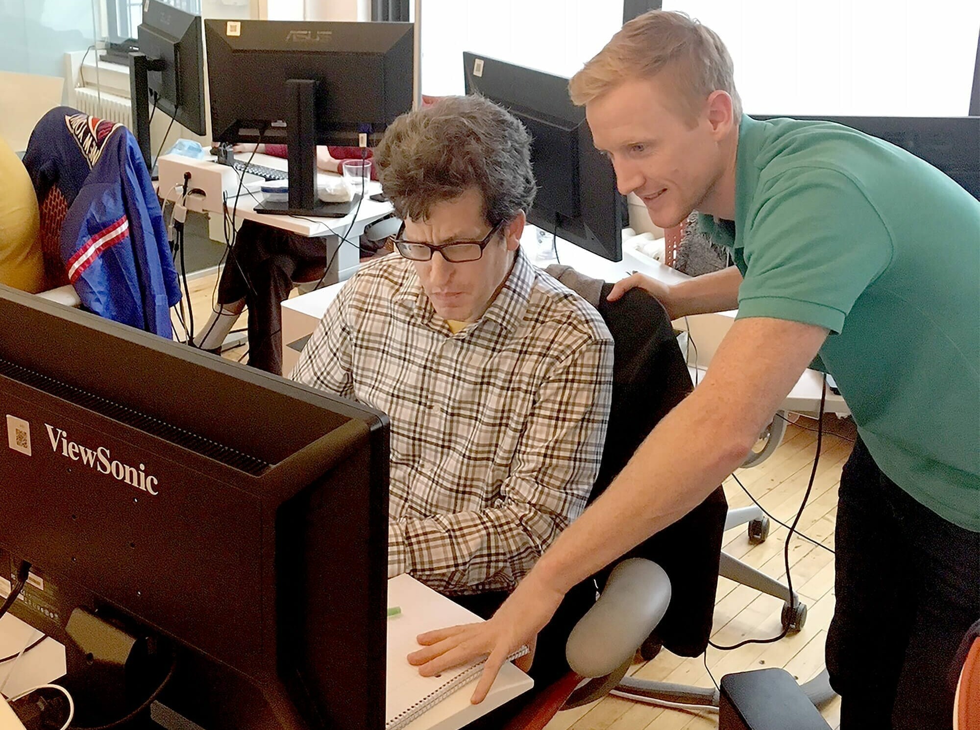 Conor O’Donoghue, Finance and Accounting Director, assists Andrew Kaen with his work