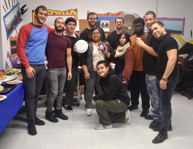 BCCO NYC staff members, including AHRC NYC's Pascual Santiago at second from right, celebrated the company's expansion at Betty Pendler Day Services