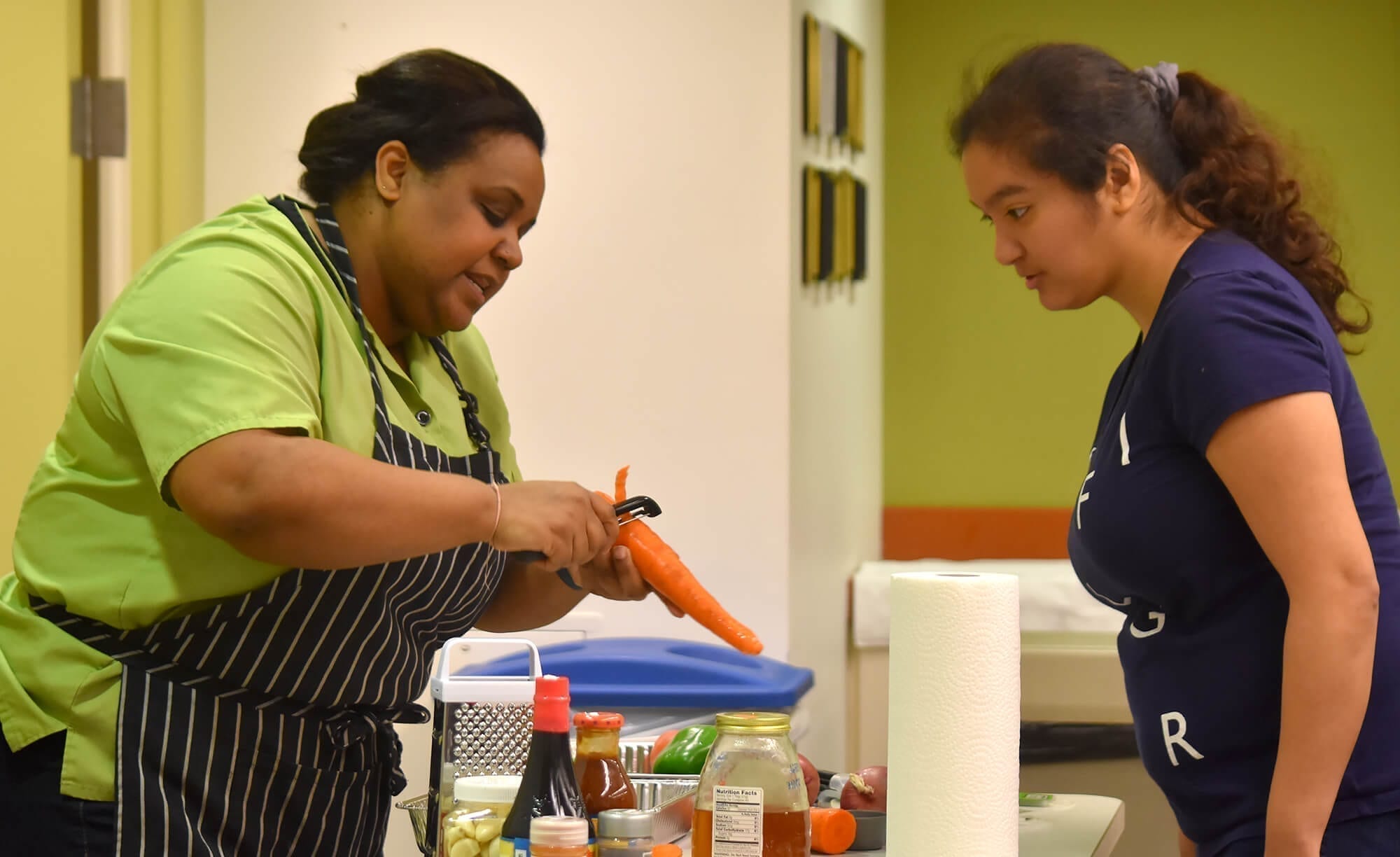 Chef Mireille Roc showed Mariella Rizzo how to easily peel a carrot