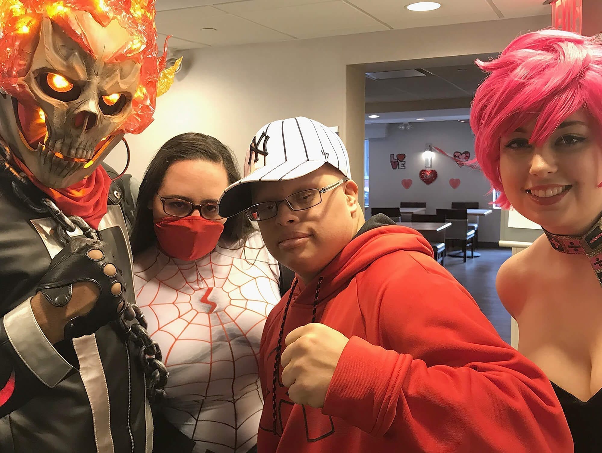 Alex Torres with a group of cosplayers at PowCon