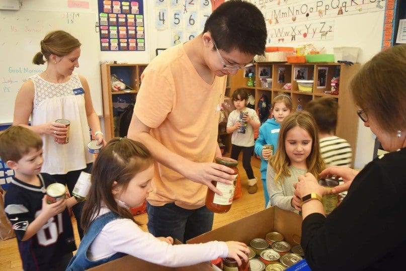 Randy helped the children pack food to be donated to a local shelter