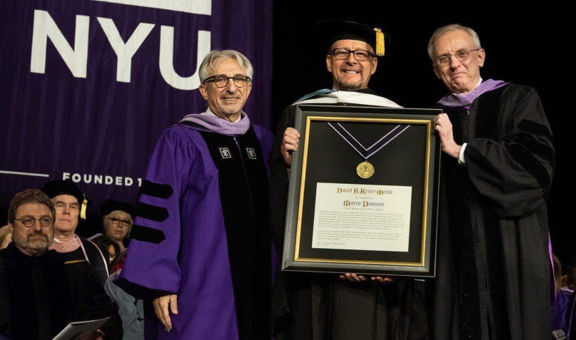 Marco Damiani accepts the Kriser Medal from the NYU College of Dentistry