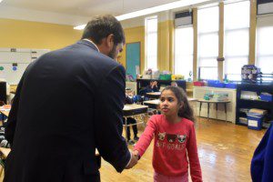 Student, Giana, greets Senator Andrew Gounardes during his visit to Brooklyn Blue Feather