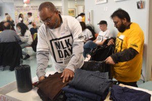 At Joseph T. Weingold Day Services, volunteers from New York Cares organized clothing that was to be distributed to people in need.