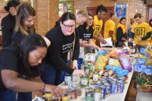 Community volunteers, including some from Williams Sonoma, packaged non perishable food items in Crown Heights.