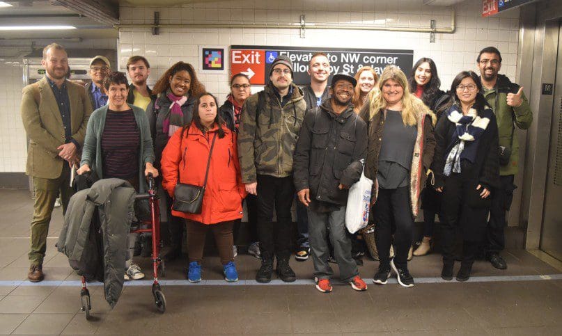 Self advocates and staff members from AHRC NYC with MTA representatives in the accessible station lab at Jay Street in Brooklyn.