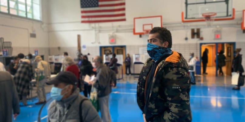 Peter Van Reppinghen waits in line to cast his ballot