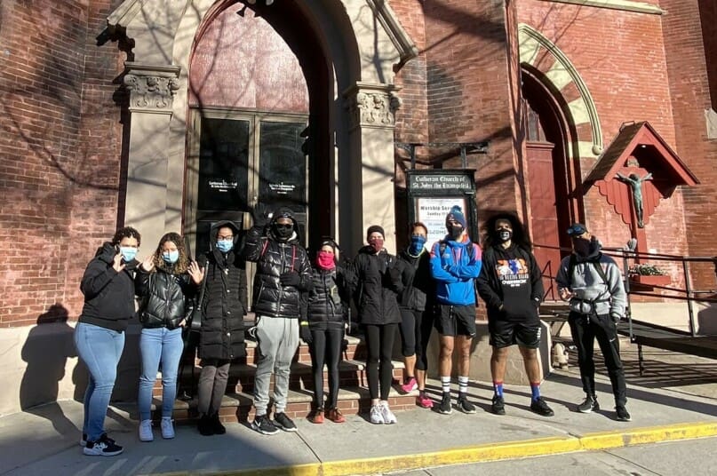 The volunteer group in front of the church