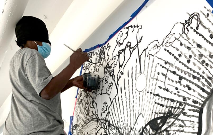 Cora Ammie painted while blindfolded under the guidance of artist Michela Martello