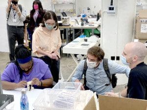 Courtnie Coles completes her work at Catbird as Airina Cokgoren, Yann Bucaille-Lanrezac, and Maximilian Cappelli-King observe.