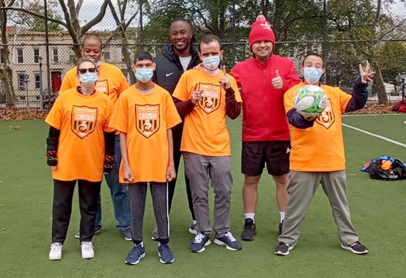 Players from Cyril Weinberg Day Center with their instructors.