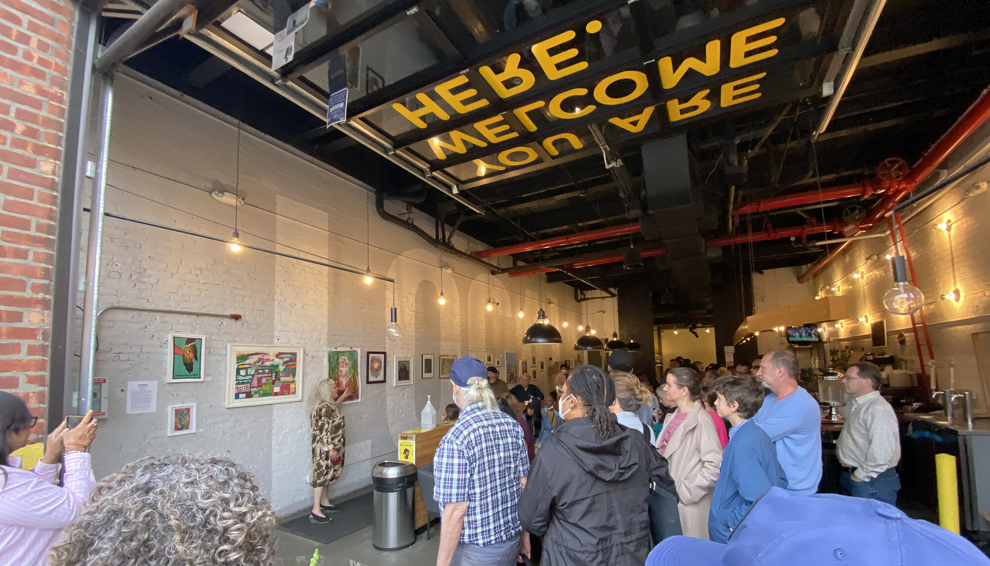 Guests gather for an exhibition held at The Local NY in Long Island City