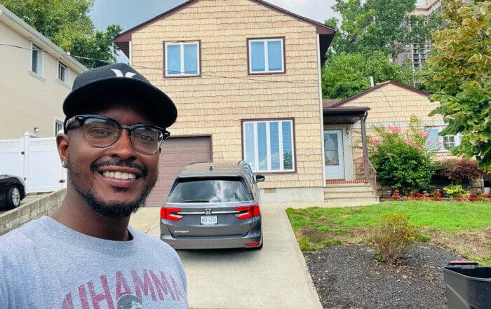 Akeem Hill in front of Glen Oaks residence, where is he is the Manager.