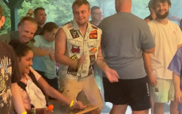 Tom McSharry dances with guests during the Lodgeapalooza music festival.