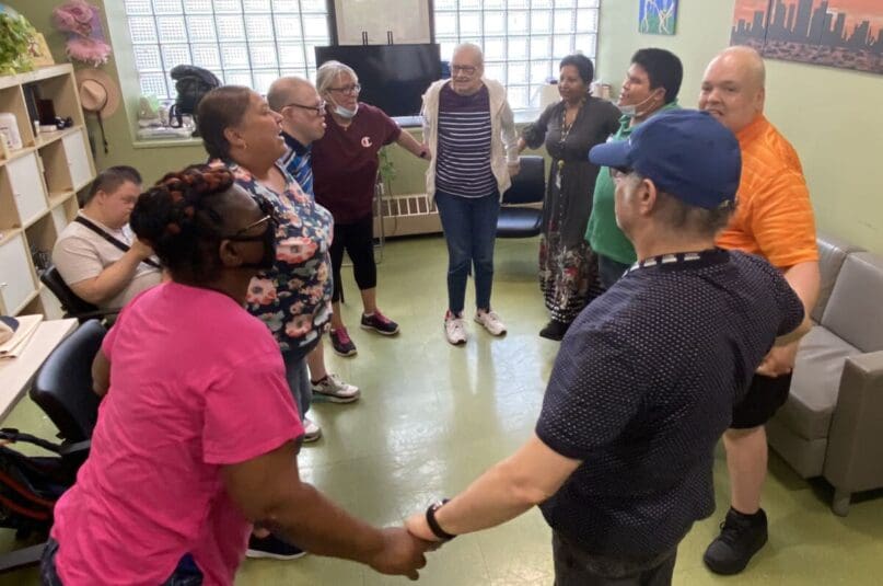 Sonia Ledesma leads the movement and memory class with seniors at Walter and Evelyn Day Services