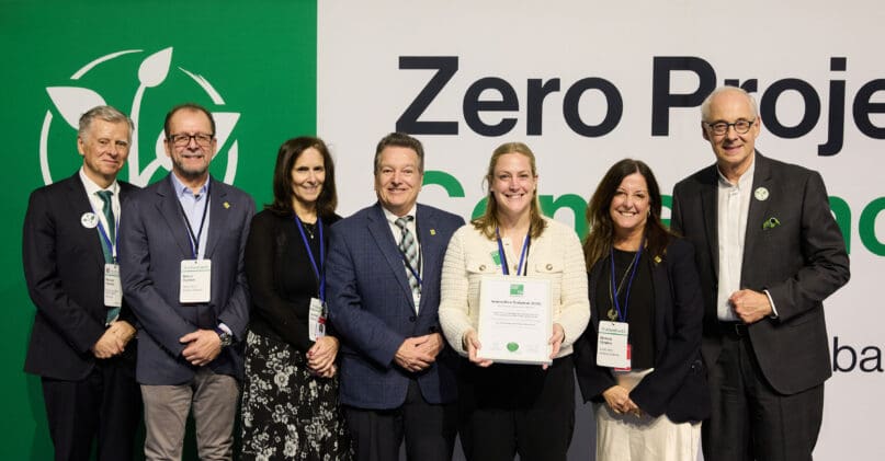 AHRC NYC's team proudly holds the Zero Project award