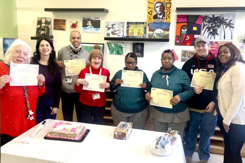 Group members and group facilitators celebrate the completion of the Health & Wellness Group Pilot