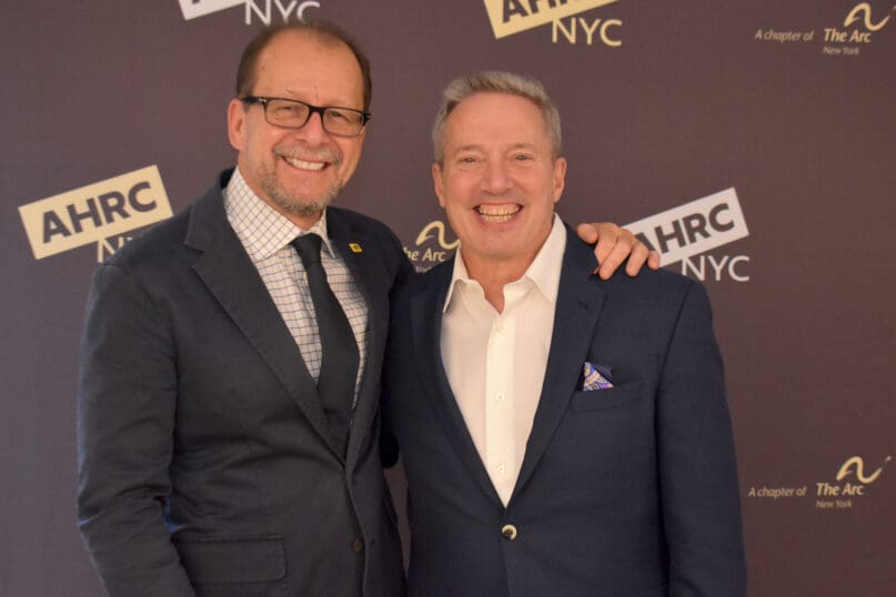 AHRC NYC's CEO, Marco Damiani with Rick Guidotti, founder of Positive Exposure