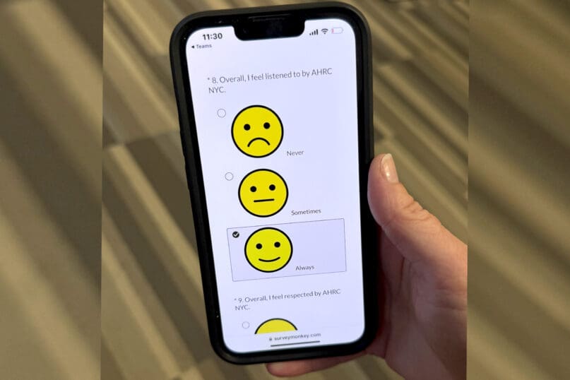 A mobile device displays one measure from AHRC NYC's 2025 Satisfaction Survey