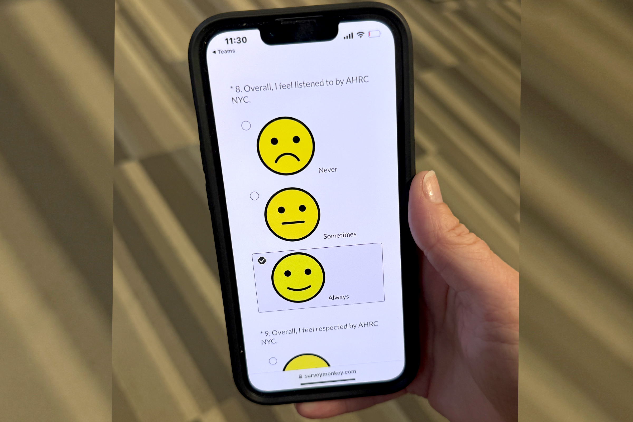 A mobile device displays one measure from AHRC NYC's 2025 Satisfaction Survey