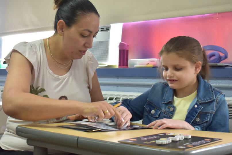 A teacher and student at James P. Murphy Staten Island Preparatory School