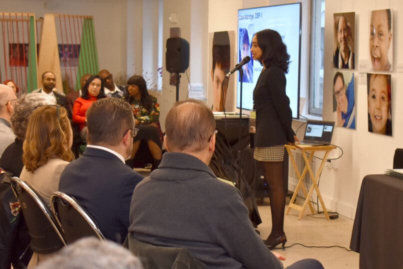 Community Support Professional, Kembelyn Diaz speaks to guests of the NADSP E Badge Academy graduation event