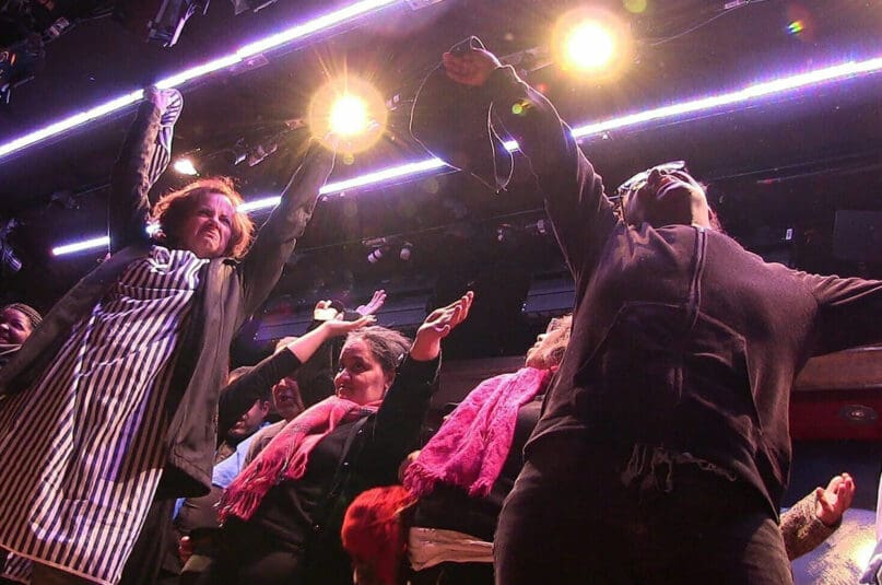 Actress Christiane Tisdale performs a rousing number with Our Broadway performers