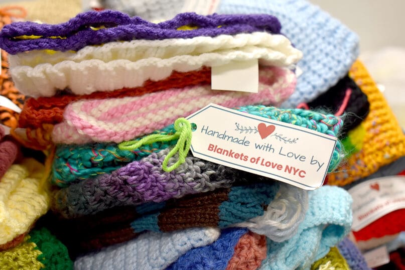 Blankets of Love provided hand knitted and crocheted blankets, scarves, hats, and gloves
