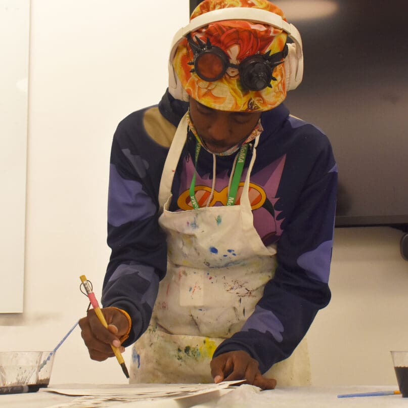 Lineton Gilchrist demonstrates painting techniques